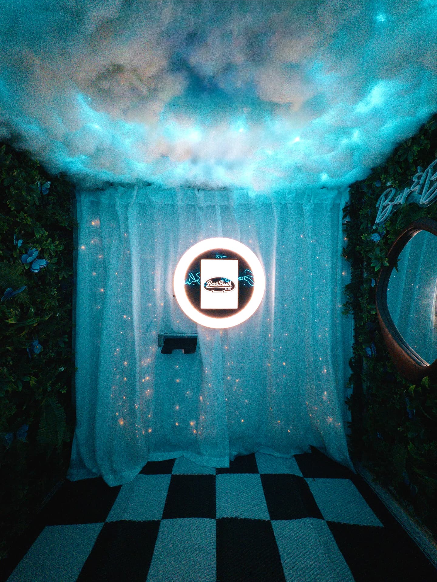 Inside the Something Blue camper with cloud ceiling and ring light